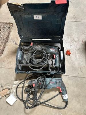 a box with tools and wires in it on the floor