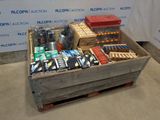 a wooden crate filled with assorted items on the floor