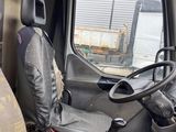 a seat in the back of a truck with a steering wheel
