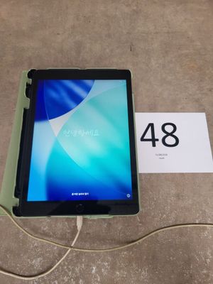 a close up of a tablet on a table with a price tag