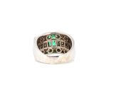 a close up of a ring with a cross on it