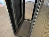 a metal door that is open in a building