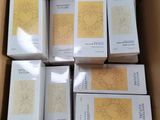 six boxes of soap sitting in a cardboard box on top of a table