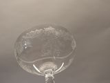 a wine glass that is sitting on top of a table