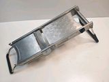 an image of a metal grater on a white surface
