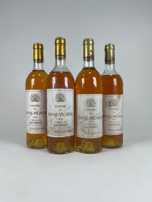 three bottles of wine sitting on top of a white table