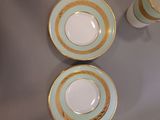 three cups and saucers sitting on a table