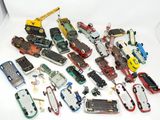 a lot of toy cars that are sitting on a table