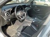 the interior of a car with a steering wheel, dashboard, and dashboard buttons