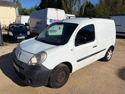 a small white van parked in a parking lot