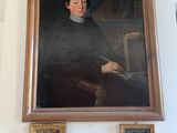 a painting of a man sitting on a mantle in a living room