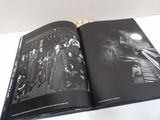 an open book with a picture of a group of people on it