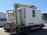 a white truck with a crane on the back of it