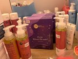 a wooden table with a lot of beauty products on it