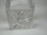 a clear glass vase with a flower inside of it