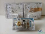 three boxes of sewing supplies sitting on a table