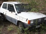 a white van that is parked in the grass