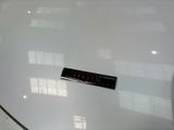 a sticker on the hood of a white car