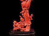 Figurine chinoise en corail sculpté représentant un dragon sur un rocher