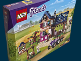 a box of legos with a horse and carriage in it