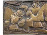 bronze plaque depicting a man on a horse and a woman on a horse