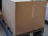 a large cardboard box on a pallet in a warehouse