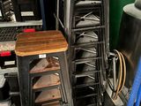 a lot of chairs and stools in the kitchen