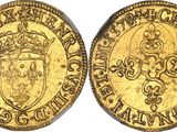 a gold coin with a crown on top of it