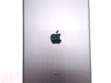 an apple ipad sitting on top of a white table next to a white wall
