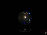 an image of a black sphere in the dark