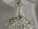 a chandelier hanging from the ceiling in a room