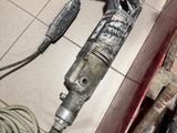 an image of a drill and other tools in a room