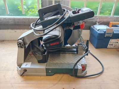 a machine that is sitting on the floor in front of a window