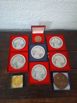 a lot of coins in a box on a table
