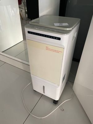 an image of a small air conditioner sitting on the floor