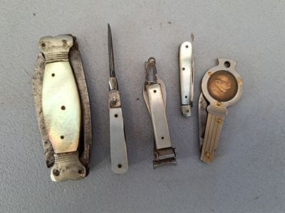 five different types of knives and a pocket knife