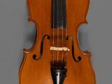 an old violin with a bow on a gray background