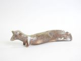 figurine of a dog on a white background