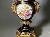 two vases that have been painted with flowers on them