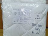 a close up of a bag of white pillows on a table