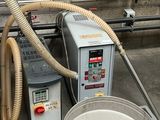 an image of a machine that has a large pot in it
