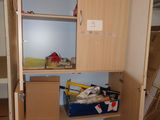 a closet with a lot of clutter in it