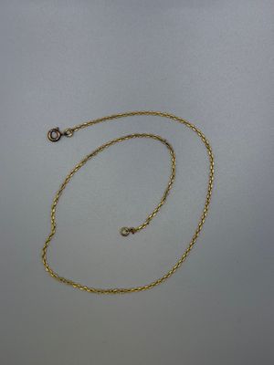 a gold chain with a clasp on a white background