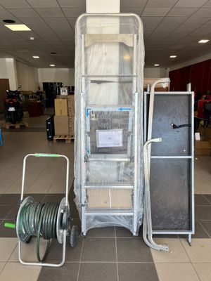 a picture of a cart with a ladder and a cart with a hose on it