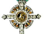 a close up of a cross on a white background with a white background