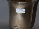 a silver cup that has a sticker on it