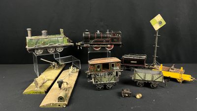 un grand nombre de trains miniatures posés sur une table