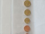 a lot of coins in a plastic bag on the table