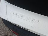 a close up of a car ' s bumper with a sticker on it