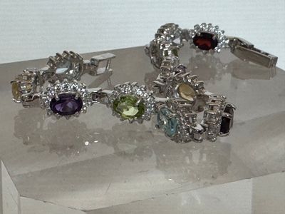 two bracelets on display on a clear display case